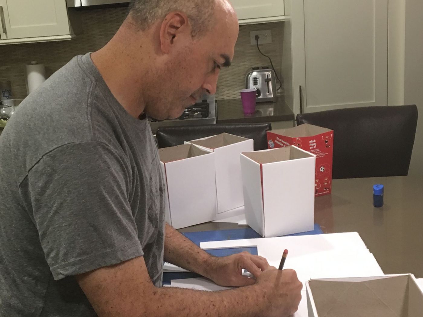 Measuring and drawing out a plan in pencil before any cutting